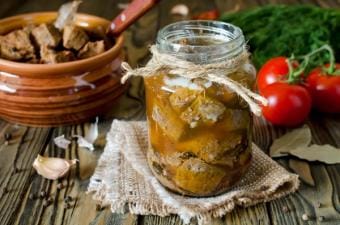 A jar of canned meat on a table, canning venison concept.