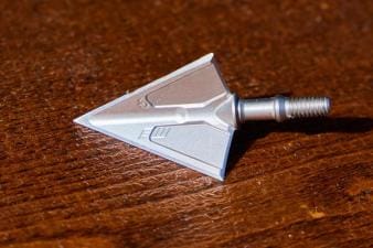 A broadhead on a table, how to test broadhead sharpness concept.