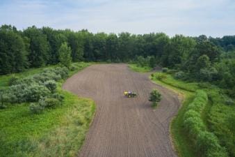 Overhead view of tractor on land, how to ask for hunting permission concept. 