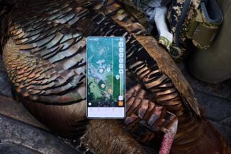 Phone showing the HuntWise turkey hunting app on a turkey after hunt.
