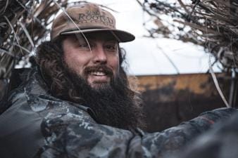 Close-up of Ben Cole in a duck blind, how to field dress a deer concept.