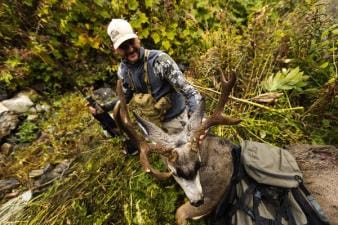 Overhead view of hunter with mule deer after hunt, when is California deer season 2026 concept.