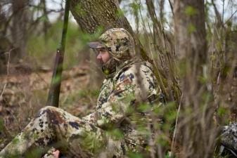 A hunter waits for a spring tom, turkey hunting concept.