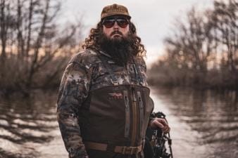 Ben Cole of RootedTV in duck hunting gear, waterfowl hunting tips concept.